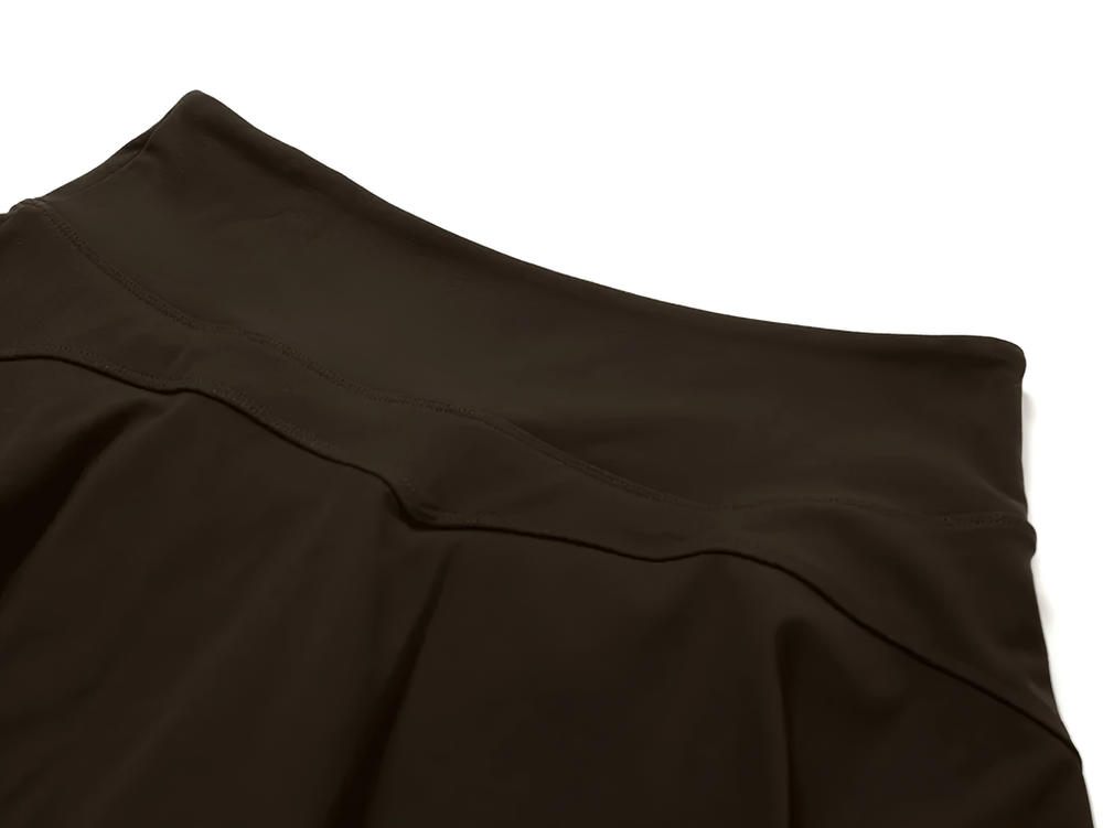 Close-up view of a stylish black sports skirt with built-in shorts, designed for tennis, running, and yoga. Model SF2366.